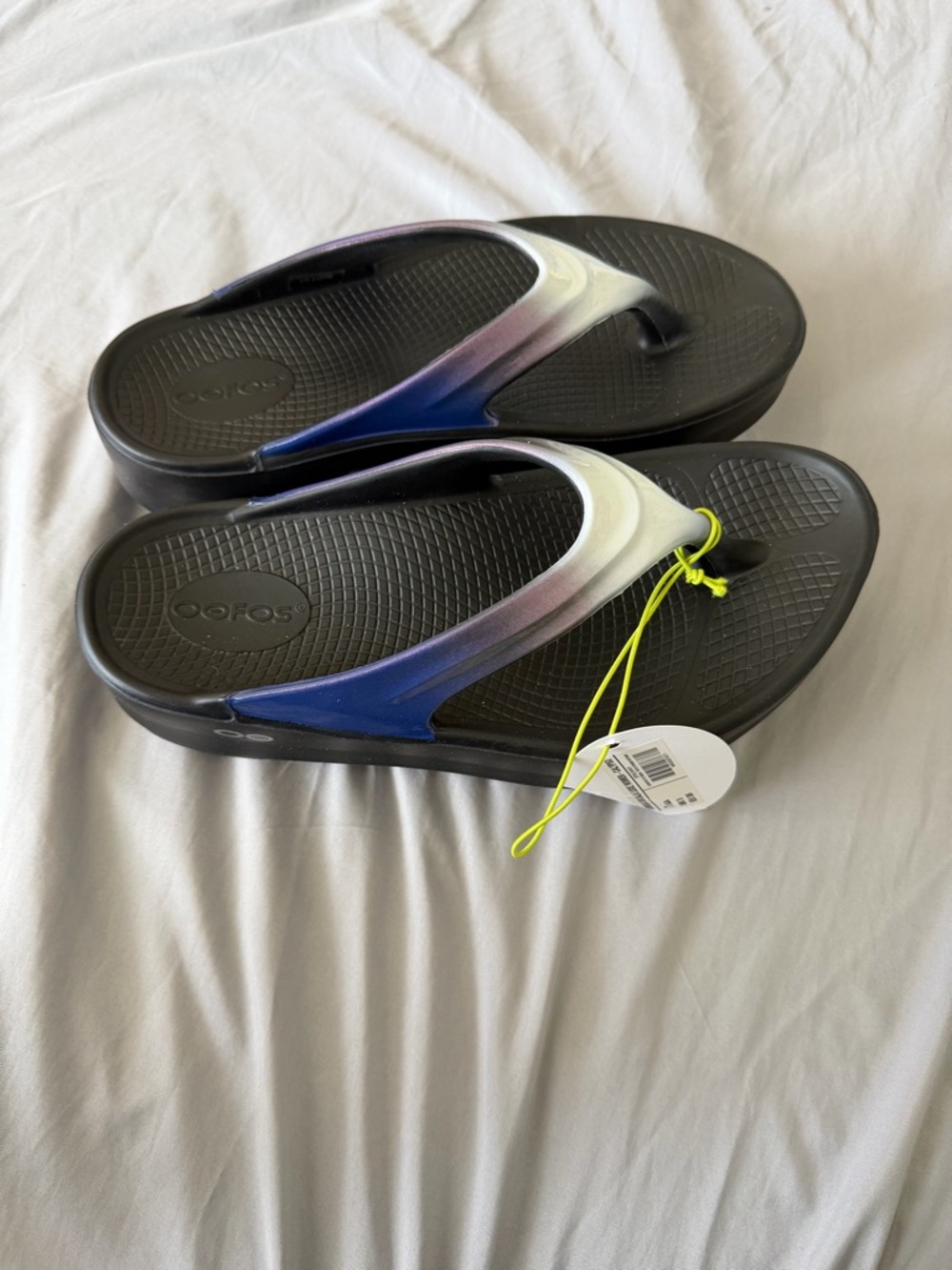 OOFOS Women's Black Flip Sandals with Blue-Purple Gradient Straps